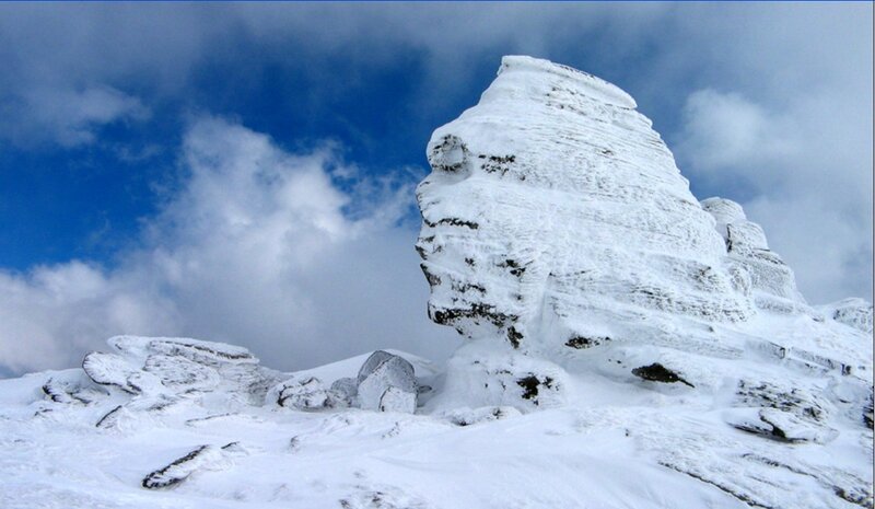 Snow-covered Rock Formation — White