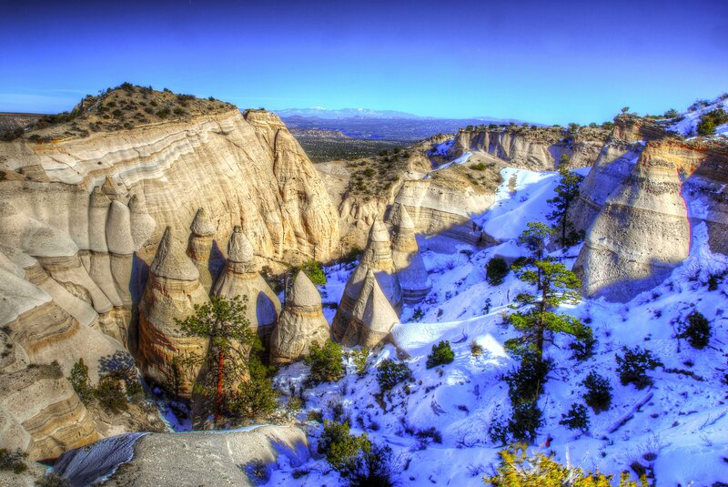 Snow-covered rock formations in canyon