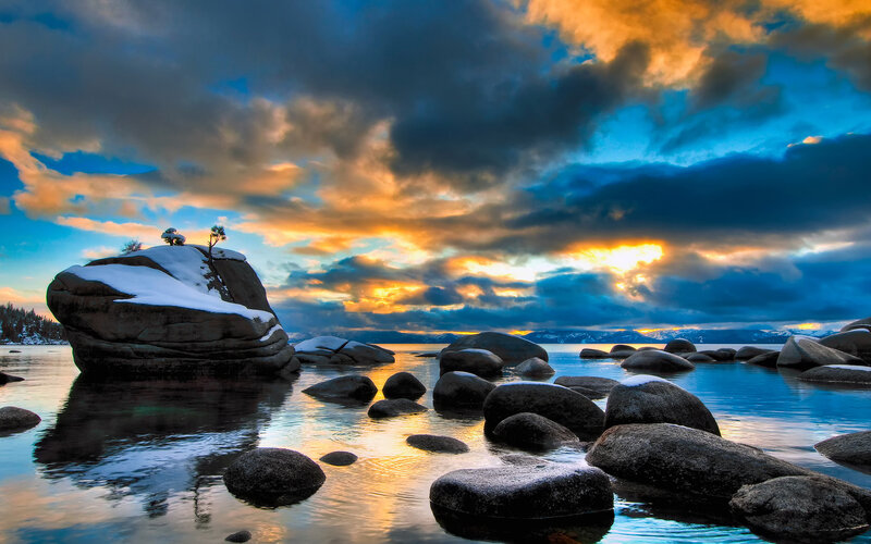 Snow-covered Rock in Lake — Blue