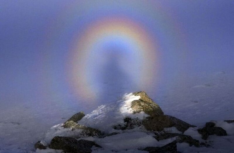 Snow-covered Rock with Rainbow
