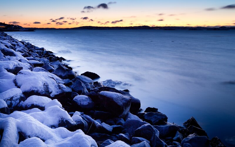 Snow-covered Rocks at Sunset