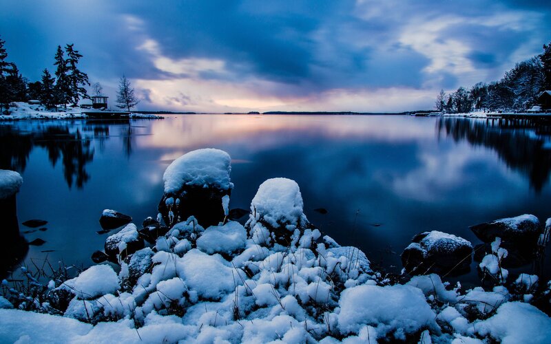 Snow-covered Rocks by Lake — Blue, Serene, Winter, Photograph