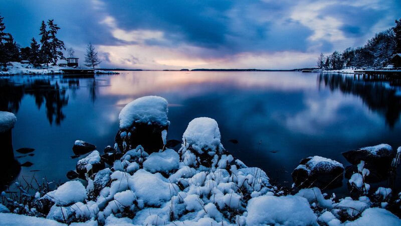 Snow-covered Rocks by Lake — Blue