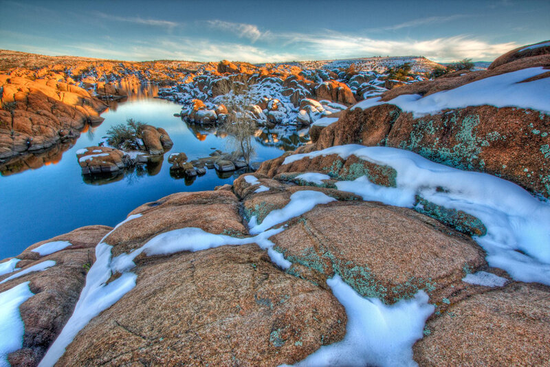 Snow-covered Rocks by River