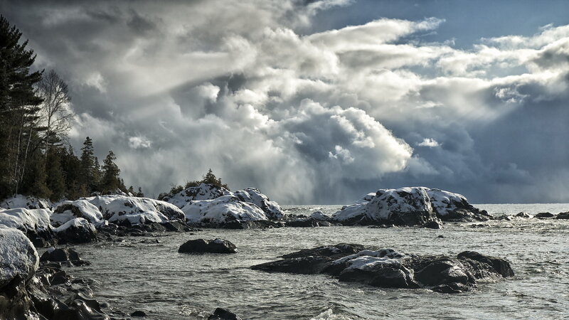 Snow-covered Rocks by Water — Gray
