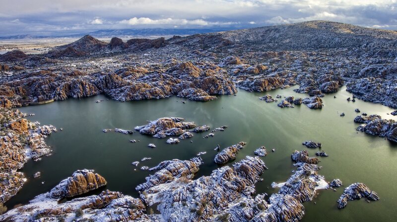 Snow-covered Rocks in Lake — Green