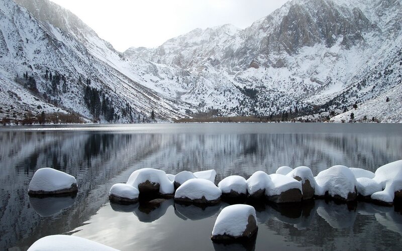 Snow-covered Rocks in Lake — White, Serene, Winter