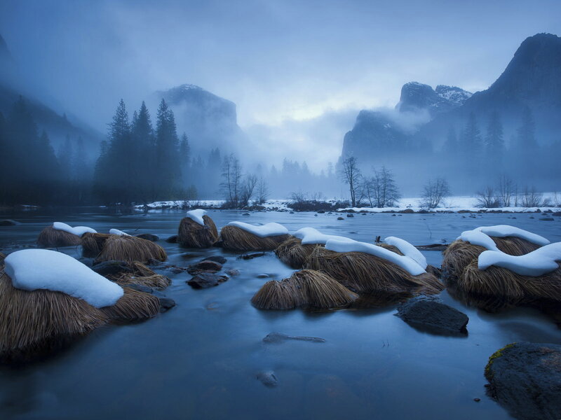 Snow-covered Rocks in River
