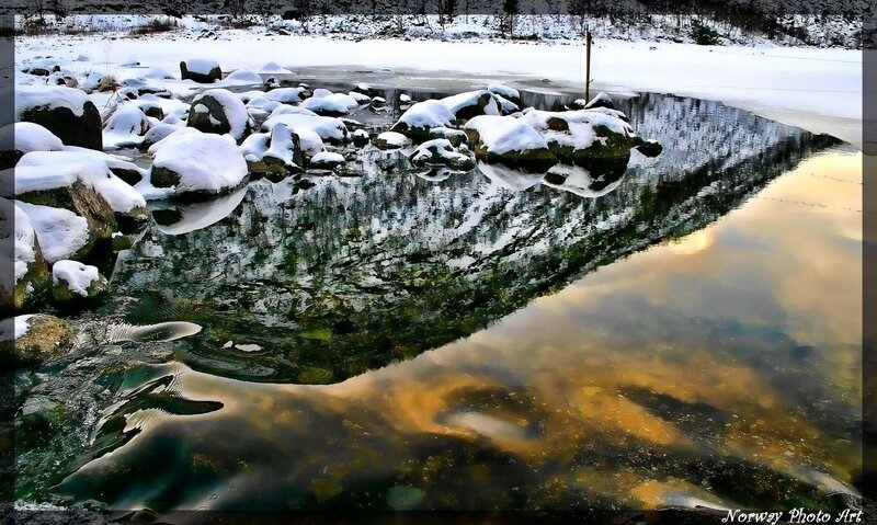 Snow-covered Rocks in Stream