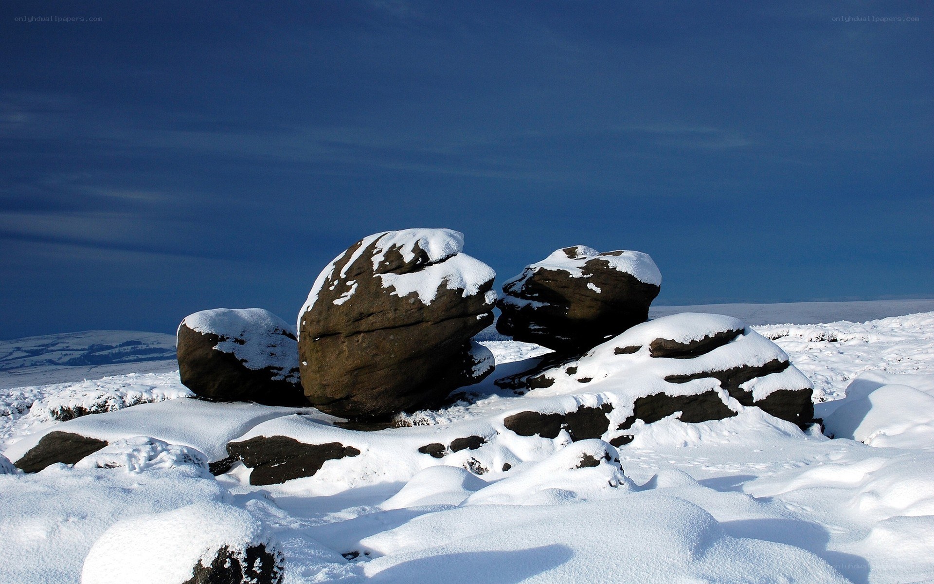 Snow-covered rocks on a hill