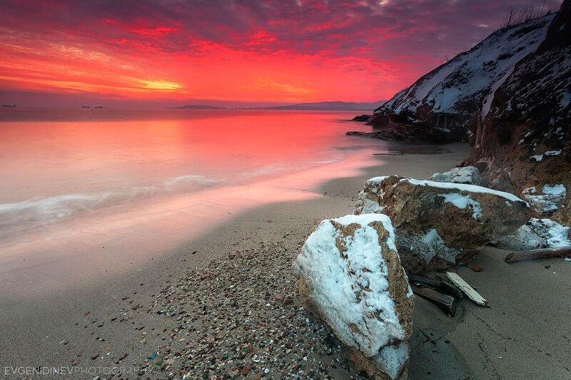Snow-covered Rocks on Beach