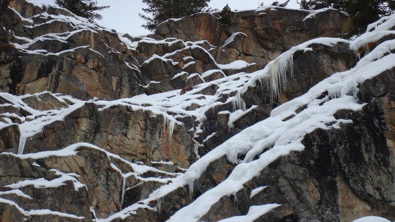 Snow-covered rocky cliff
