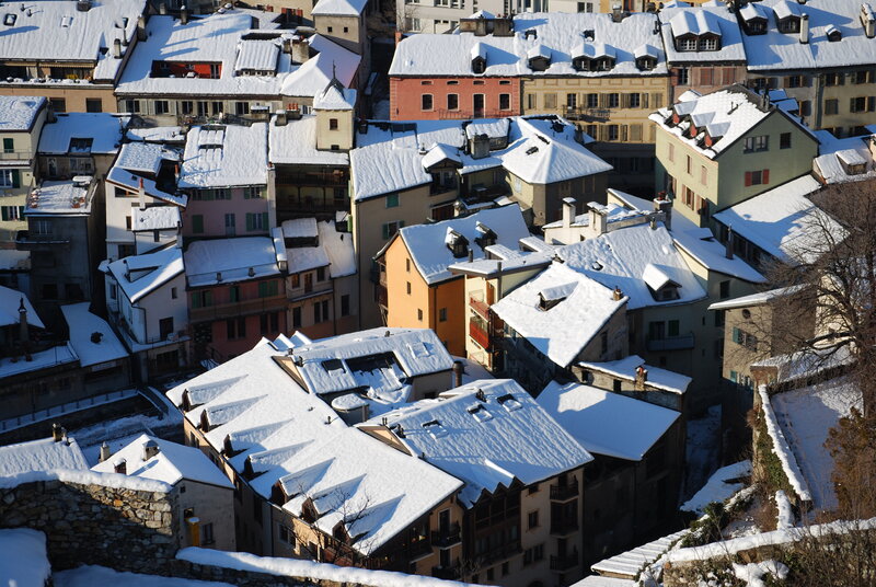 Snow-covered rooftops in a European town