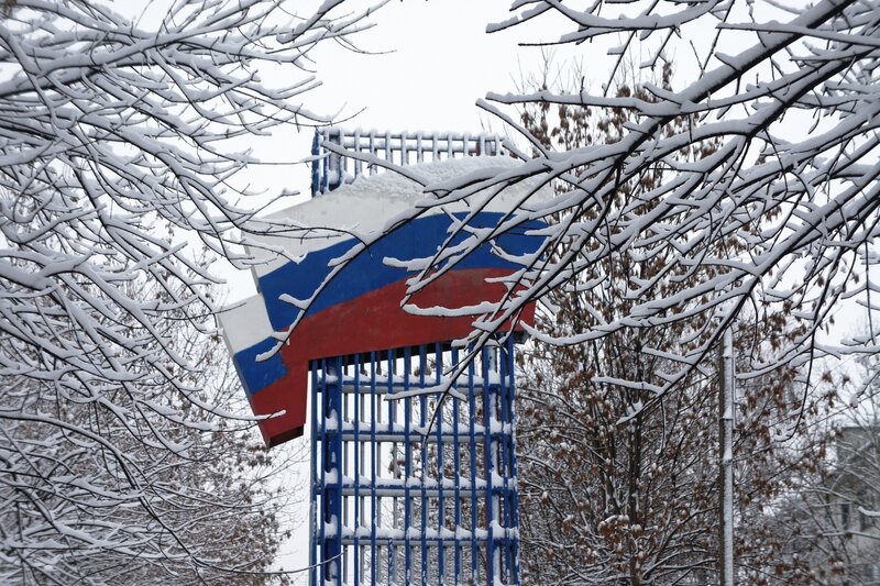 Snow-covered Russian flag monument