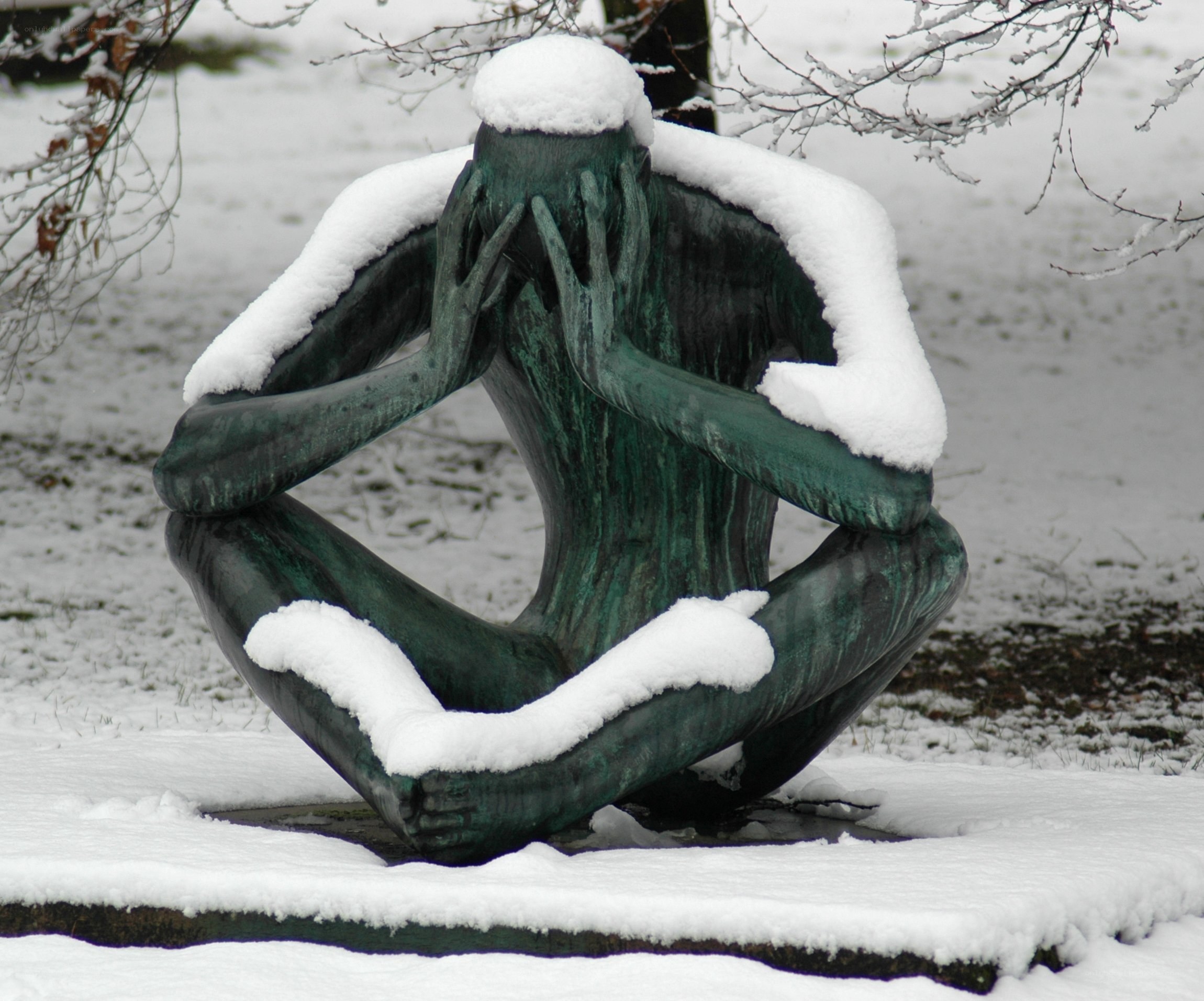 Snow-covered sculpture in winter