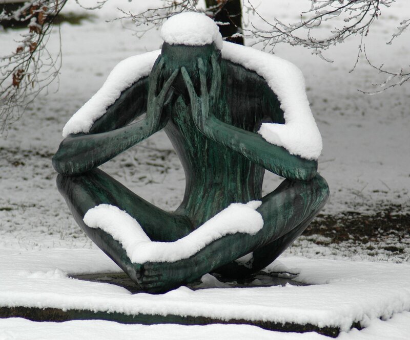 Snow-covered sculpture in winter