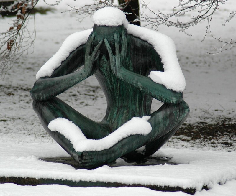 Snow-covered sculpture in winter