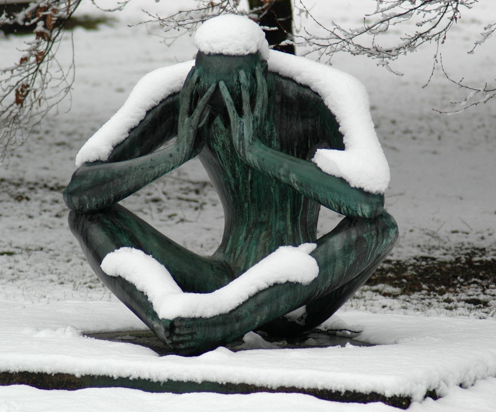 Snow-covered sculpture in winter