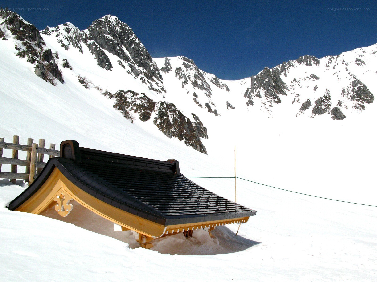 Snow-covered shrine in mountains