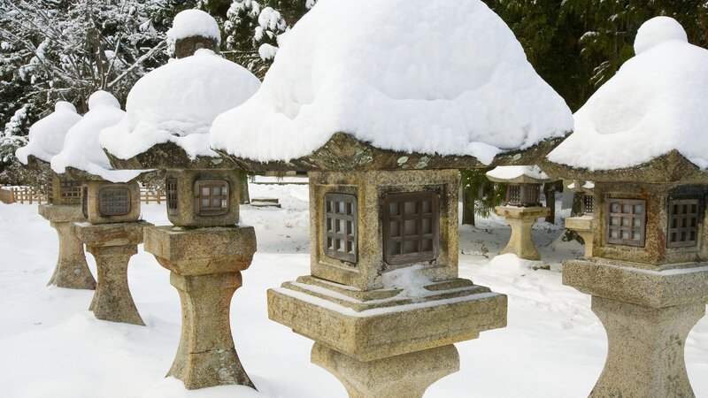 Snow-covered stone lanterns