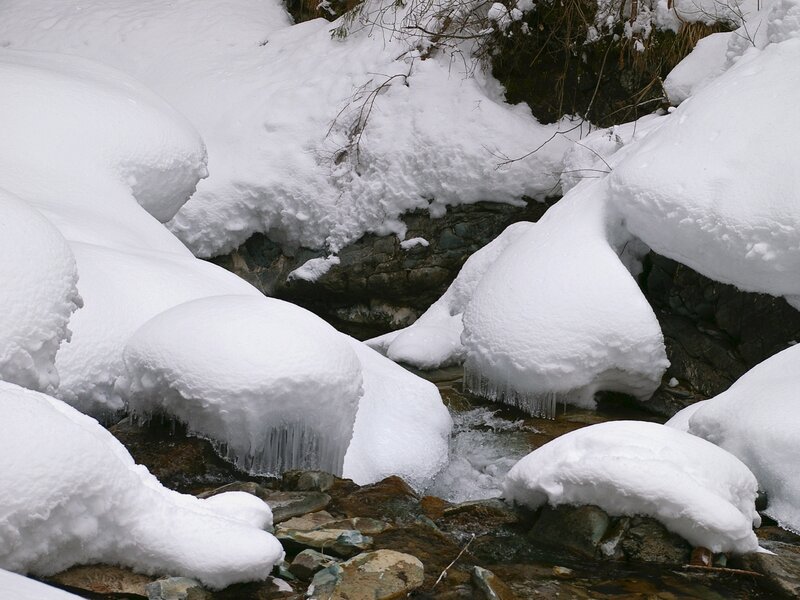 snow-covered stream in winter