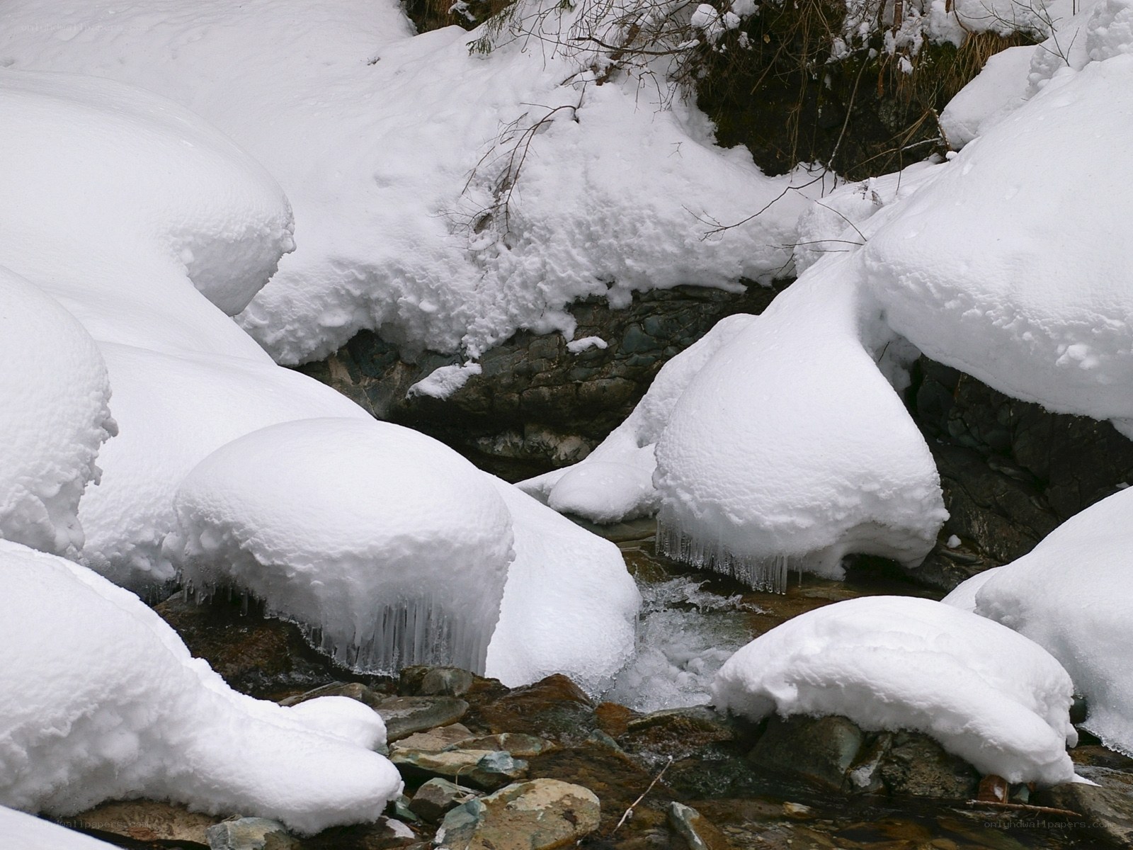 snow-covered stream in winter