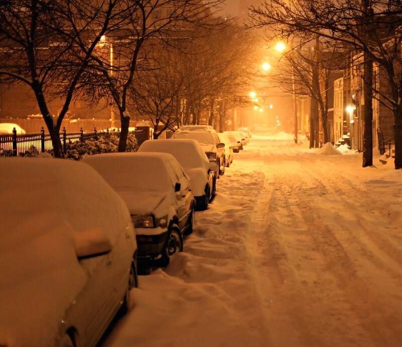 Snow-covered street at night