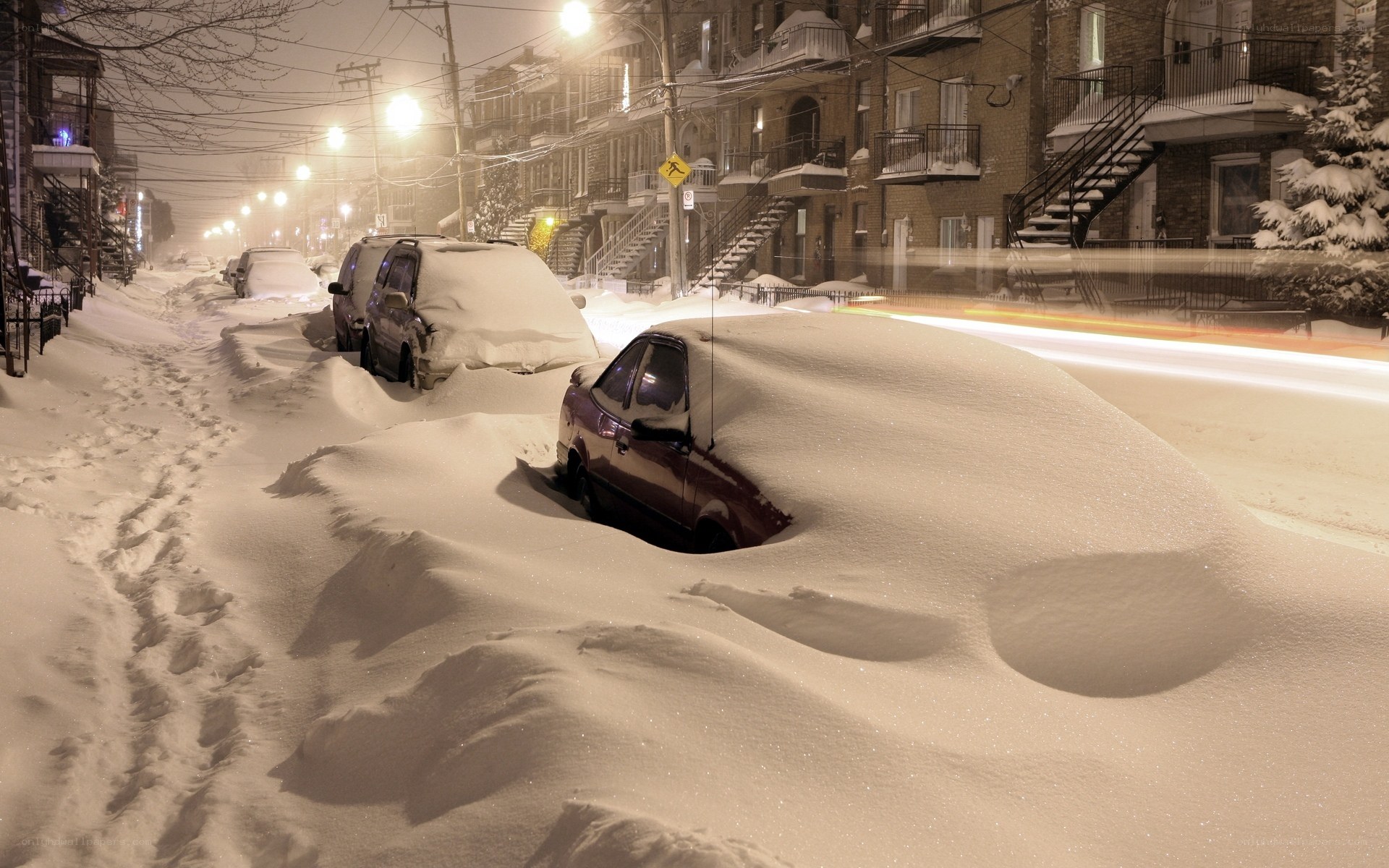 Snow-covered street at night