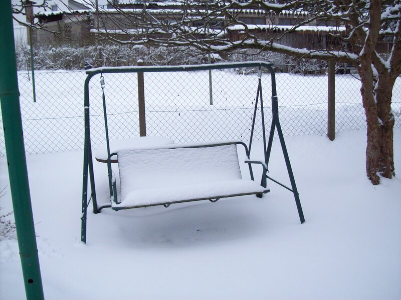 Snow-covered Swing