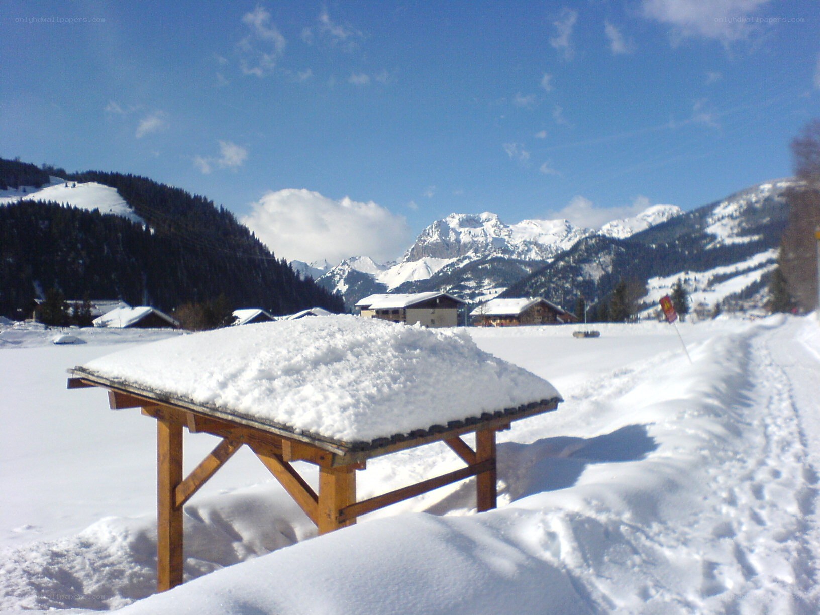 Snow-covered table in mountain village