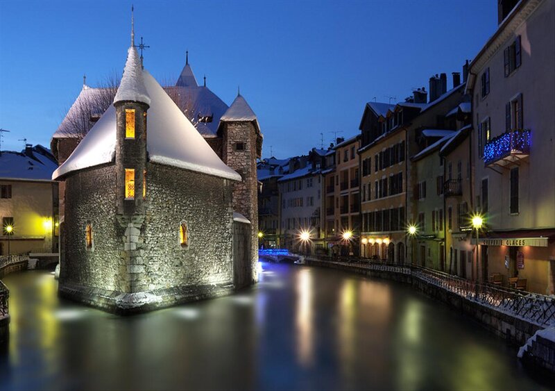 Snow-covered Tower in Canal