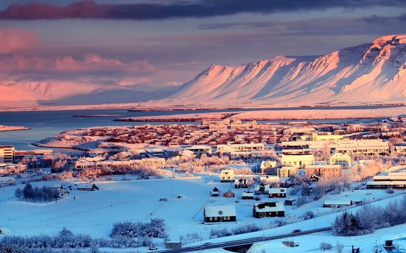 Snow-covered Town at Sunset