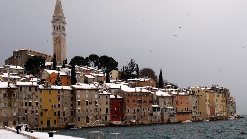 Snow-covered Town by Sea
