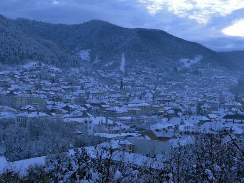 Snow-covered town in mountain valley