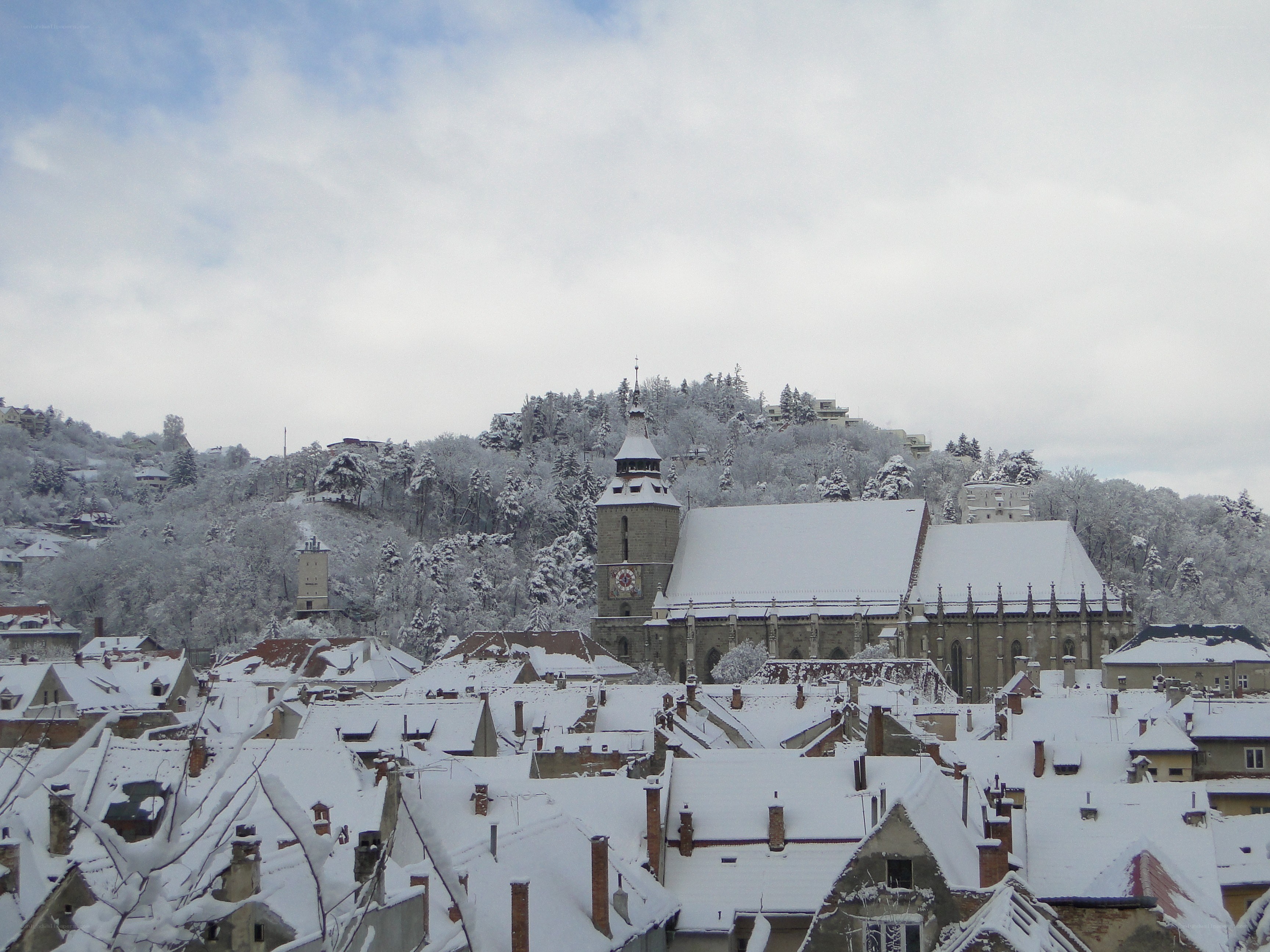 Snow-covered town with church