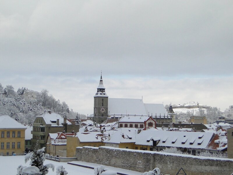 snow-covered town with church