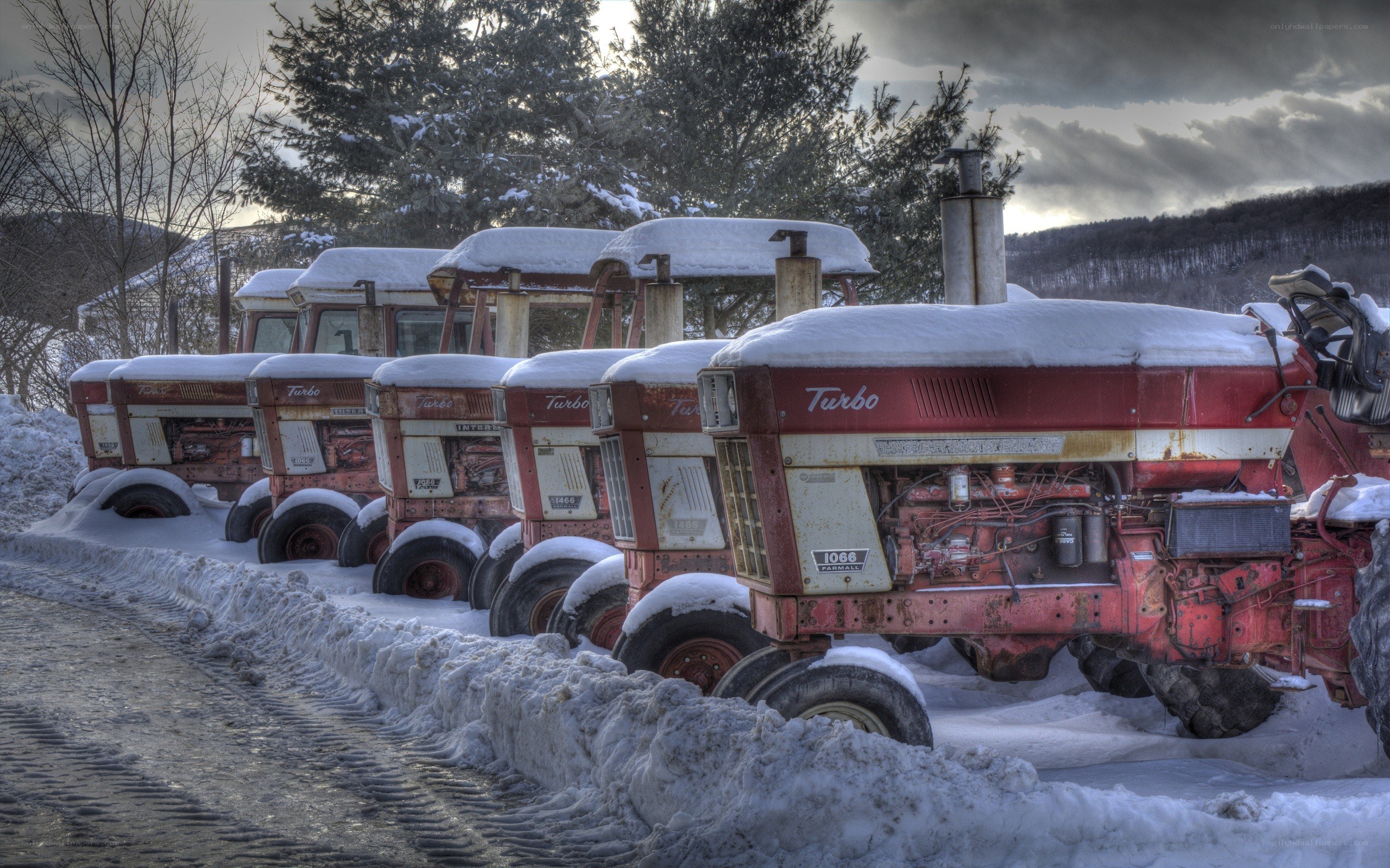 Snow-covered tractors in winter