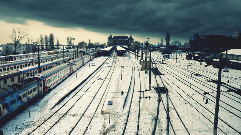 Snow-covered Train Yard — Gray, Dramatic, Winter, Photograph