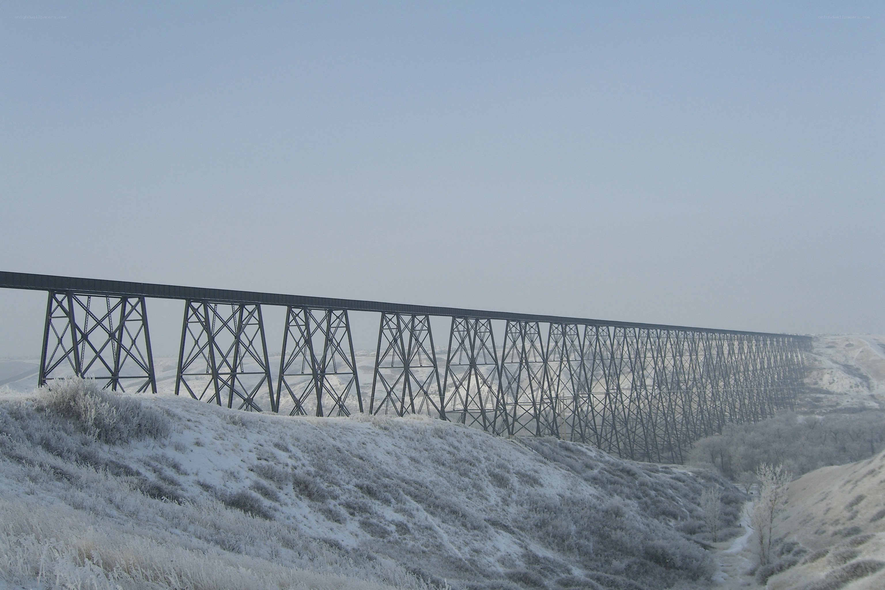 Snow-covered trestle bridge