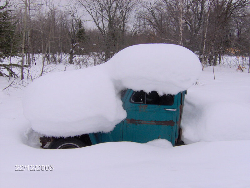 snow-covered truck in winter