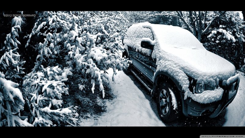 Snow-covered truck in winter