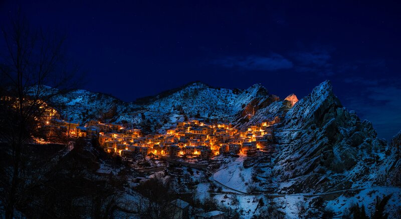 Snow-covered Village at Night — Blue, Serene, Photograph, Mountains, Snow