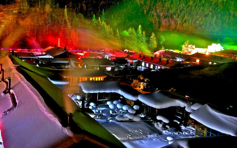 Snow-covered Village at Night — Green