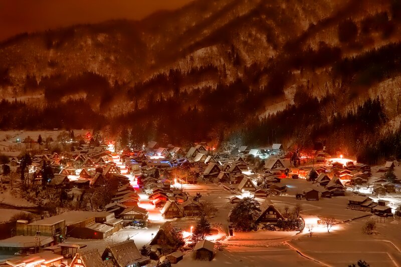 Snow-covered Village at Night — Orange