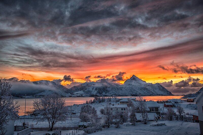 Snow-covered Village at Sunset — Orange, Dramatic, Photograph