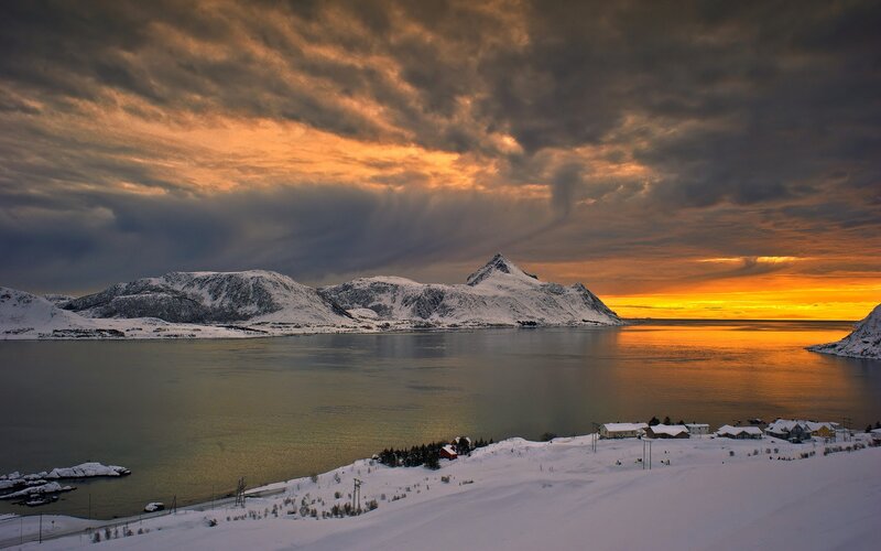 Snow-covered Village at Sunset — Orange, Dramatic