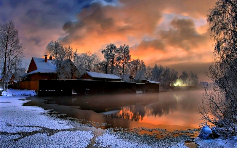 Snow-covered Village at Sunset