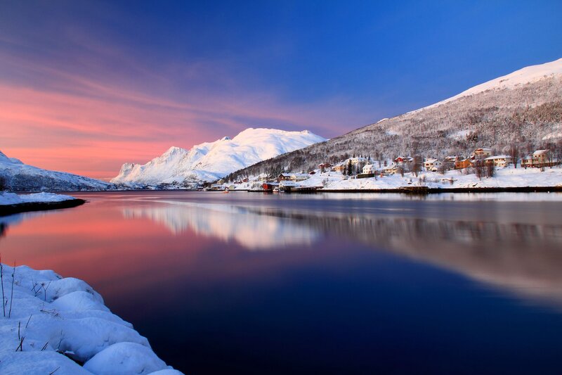 Snow-covered Village by Fjord — Blue, Serene, Sunset