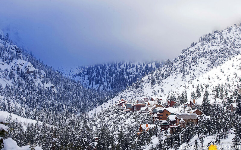 Snow-covered Village in Mountains — White, Serene, Winter, Photograph