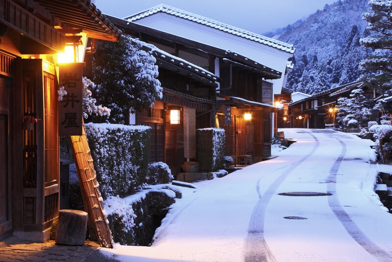 Snow-covered Village Street — White, Serene, Winter, Photograph, Traditional Buildings